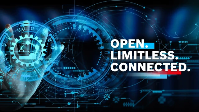 深色背景中嵌入互锁齿轮，旁边是白色字体的标语“Open. Limitless. Connected.”